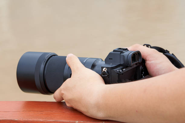 istock A photographer shoots with a professional mirrorless camera 1434143362