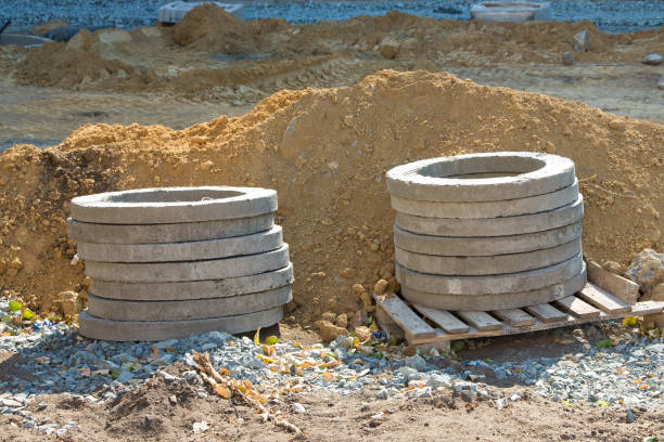 istock Reinforced concrete rings lie on pallets at the construction site 1434144798