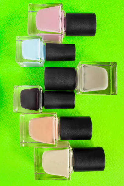 istock Nail polish on green background 1434145158