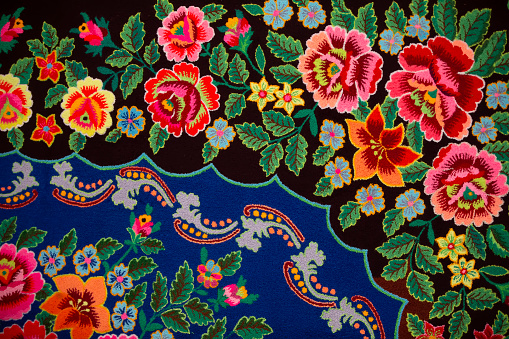 Traditional Slavic ancient embroidered bedspread. Ethnic Ukrainian or Belarusian pattern on the fabric.