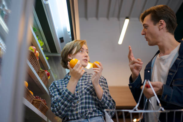 istock Couple is buying fruit at supermarket. 1434147652