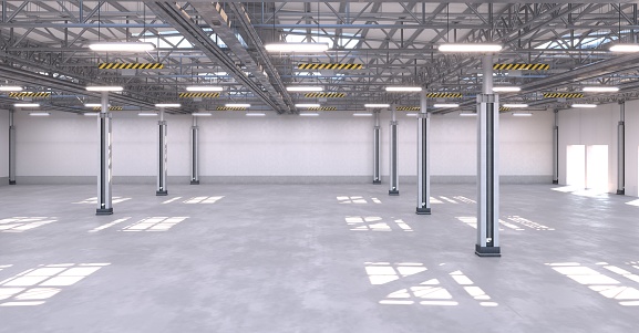 Large empty warehouse with steel structure and trussed roof. Clean factory building, ready to be put in operation. Bright daylight. Digitally generated image.