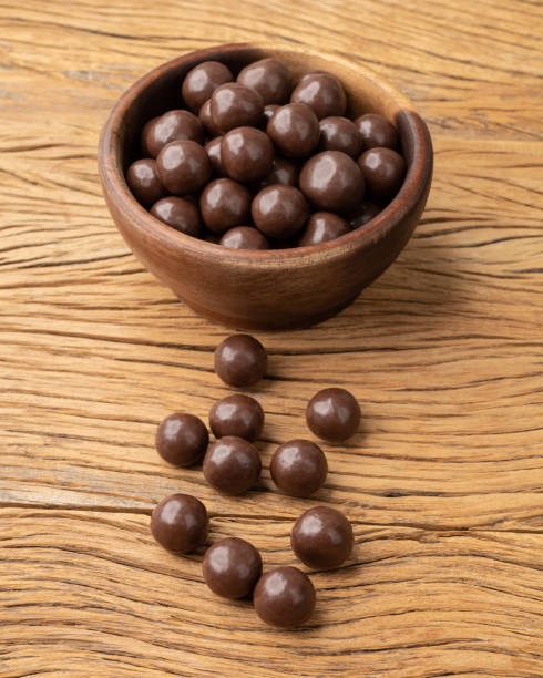istock Chocolate malted balls on a bowl over wooden table 1434151575