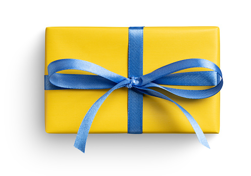 Yellow gift box with blue ribbon on white. This file is cleaned, retouched and contains clipping path.