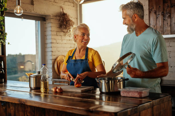 istock Senior couple cooking at home. 1434152596