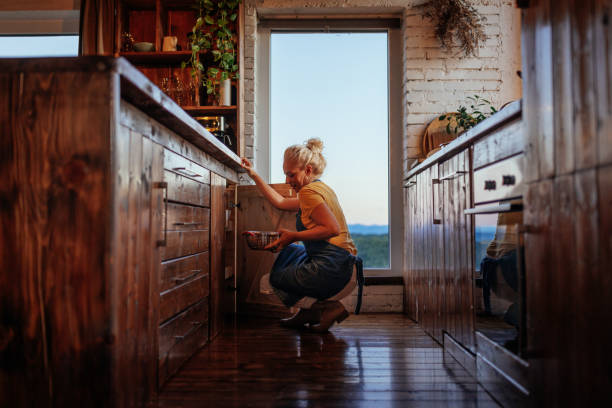 istock Senior woman cooking in vintage kitchen. 1434154554