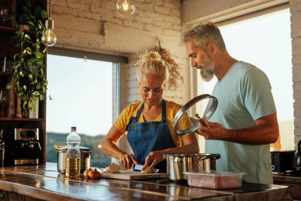 istock Happy senior couple cooking. 1434155046