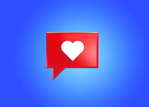 Red speech bubble with heart shape over blue background. Horizontal composition with copy space. Front view.