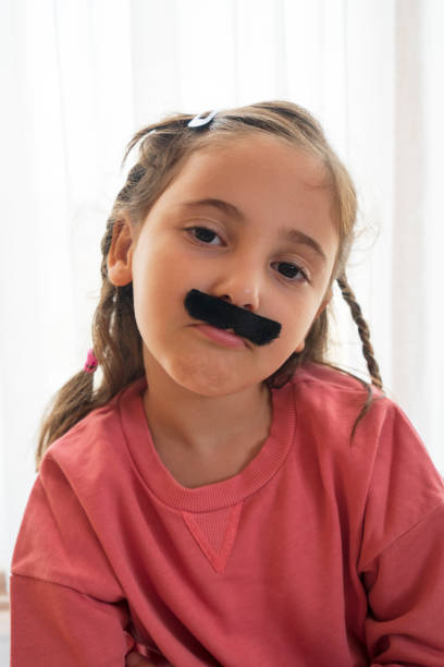 istock Mustached Little Girl 1434158779