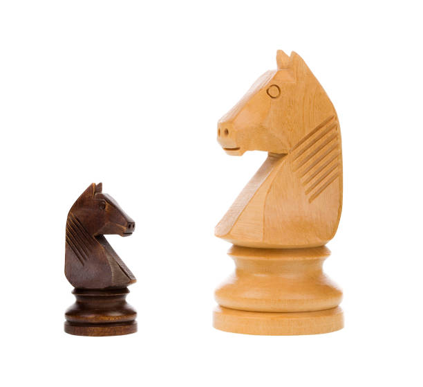 istock Chess knights isolated on white background - concept 1434160818