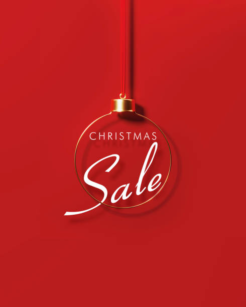 istock Christmas Sale Behind Gold Colored Bauble On Red Background 1434161299