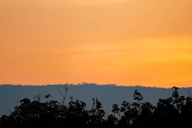 istock Sunset sky and clear clouds over hill background 1434161424