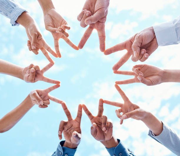 istock Star sign with hands for teamwork, marketing collaboration support and peace for success in corporate partnership against blue sky in city. Business people working in trust and planning strategy 1434162622