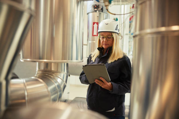 istock Mature female engineer working on a digital tablet in a power station 1434164174