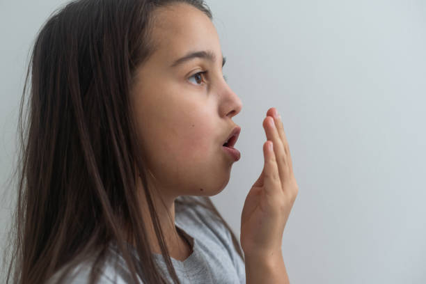 Side view of caucasian shouting girl on pure white background.