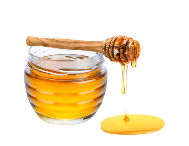 istock Honey isolated on white background. 1434169250