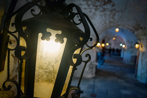 Antique lit lantern in a historic armory in Ponta Delgada, Saint Michael Portugal.