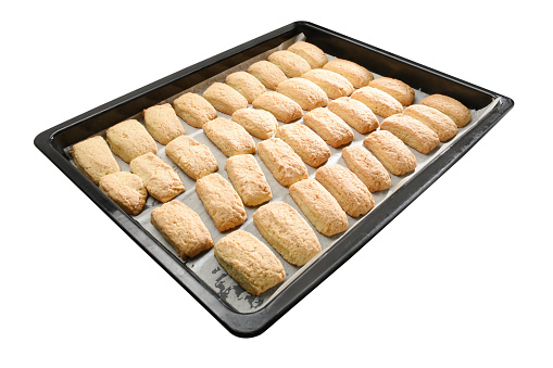Homemade cookies in the baking sheet isolated on the white background with clipping path