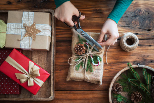 istock Woman makes rustic, zero waste, plastic free gift package for Christmas. Natural aestetic. 1434177544