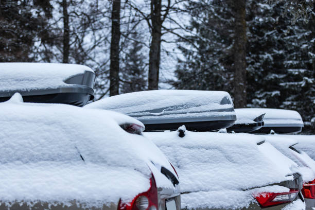 Government Camp, Oregon, USA - January 22, 2012: Vehicles make their way through the snowy pass to Timberline on Mt. Hood during a winter snowfall.