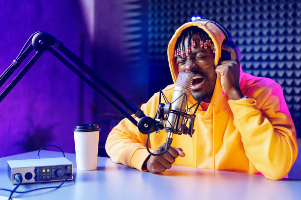 istock Young African performer recording his new track in recording studio 1434179675