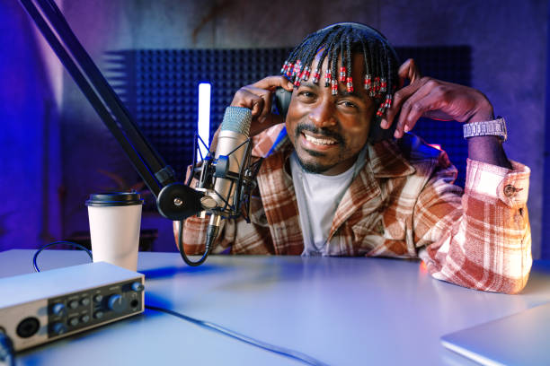 istock Happy young african man audio blogger broadcasting at studio 1434180345