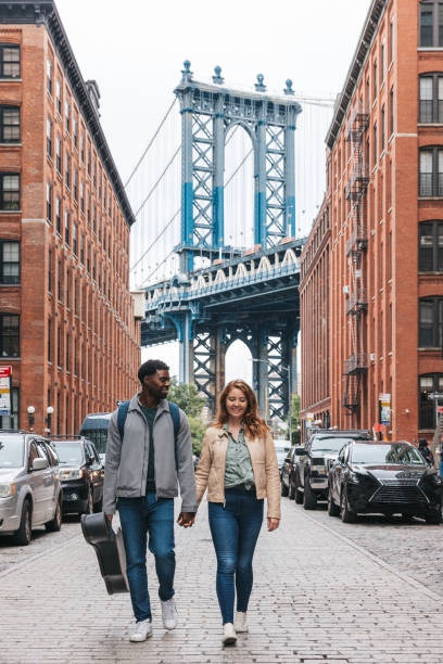 istock Couple walking down the streets discovering New York 1434180406