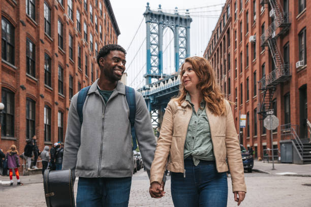 istock Couple walking down the streets discovering New York 1434180409