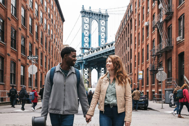 istock Couple walking down the streets discovering New York 1434180419
