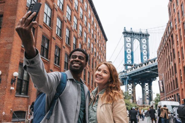 istock Couple walking down the streets discovering New York 1434180433