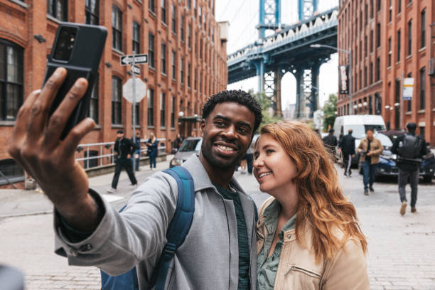 istock Couple walking down the streets discovering New York 1434180436