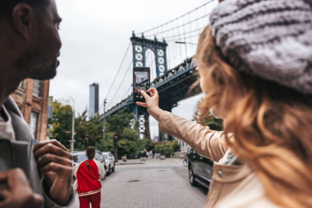 istock Couple walking down the streets discovering New York 1434180441