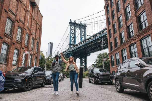 istock Couple walking down the streets discovering New York 1434180445