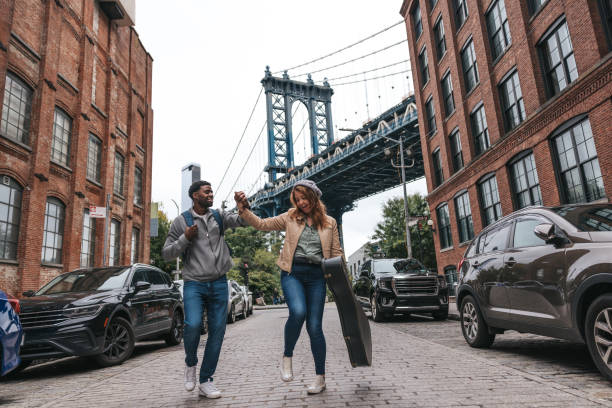 istock Couple walking down the streets discovering New York 1434180446