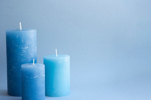 White candles on a blue background