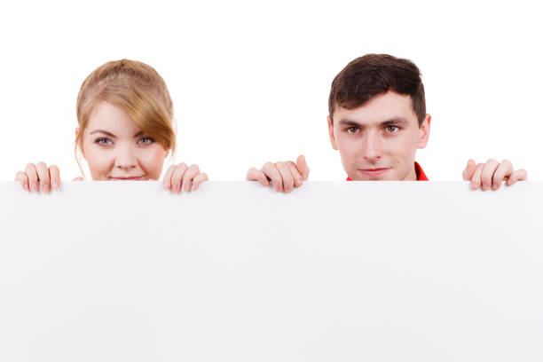 istock Couple with blank presentation board banner sign 1434182645