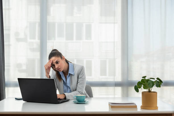 Frustrated annoyed woman confused by computer problem, annoyed businesswoman feels indignant about laptop crash, bad news online or disgusting video on web, stressed student looking at broken pc stock photo