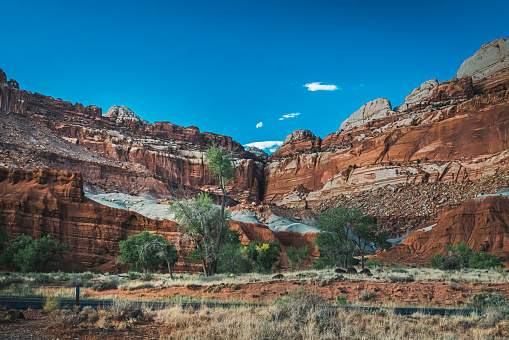 Road through Capitol Reef National Park, mount, trees.