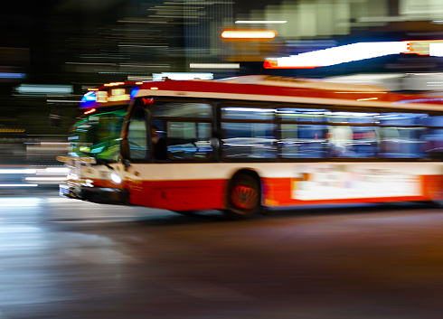 Public Transportation: Toronto bus in blurred motion.