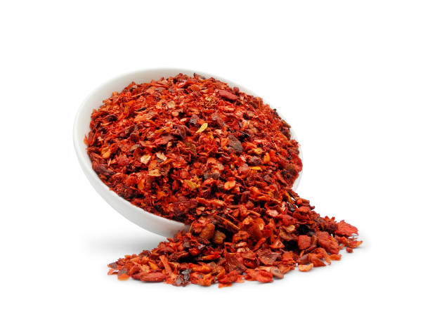 istock Paprika flakes in bowl isolated on white 1434189110