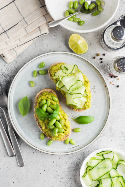 istock Two avocado toasts with green vegan toppings 1434190281