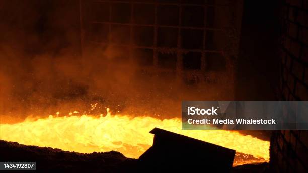 Liquid Metal From Blast Furnace Liquid Metal Pouring Stream Stock Photo - Download Image Now