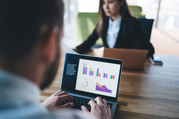 istock Businessman working on laptop creating graphs and charts 1434193068