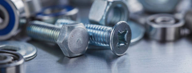 istock set of different nuts, bolts, screws, washers and drill bits,thread tap and mill cutters on steel plate background. Locksmithing deal. 1434193714