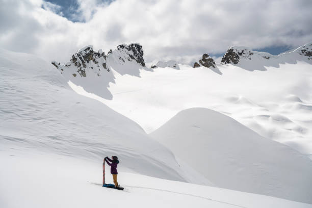istock Woman backcountry snowboarding 1434193770