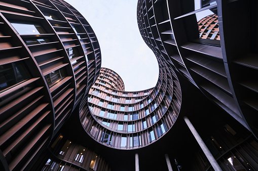Copenhagen, Denmark - Sept 2022: Axel Towers comprising five round towers Modern Office Buildings Glass And Copper in Copenhagen opposite of Tivoli Gardens designed by Lundgaard & Tranberg Arkitekter