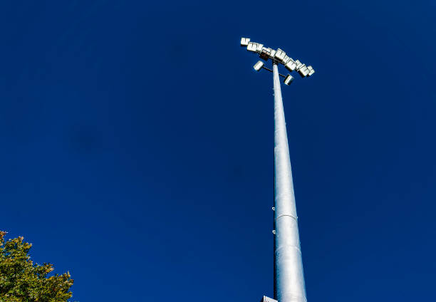 istock Stadium lighting on a tall pole in a clear blue sky 1434197333