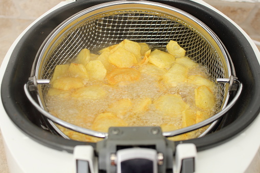 homemade potato chips in the fryer