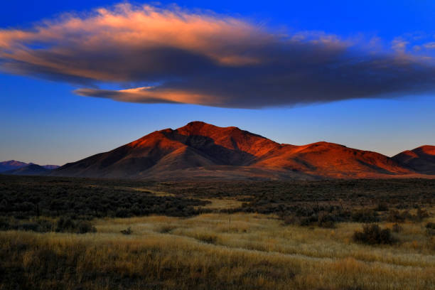 istock Sunset or Sunrise on Mountain with Cloud in Sky 1434200300