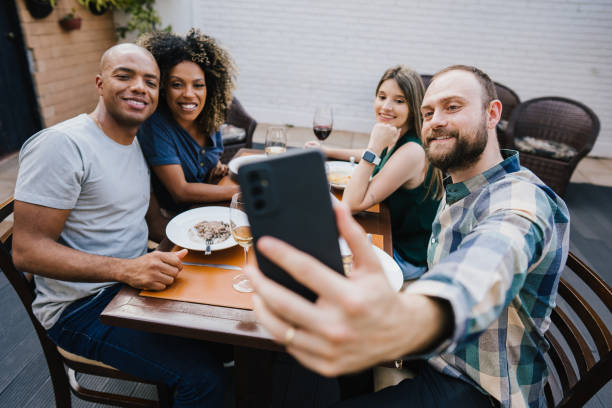 istock Group of friends taking selfie at restaurant 1434202903